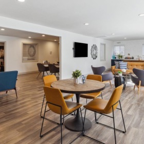 Enjoy our resident-only features a lounge room with tables and chairs